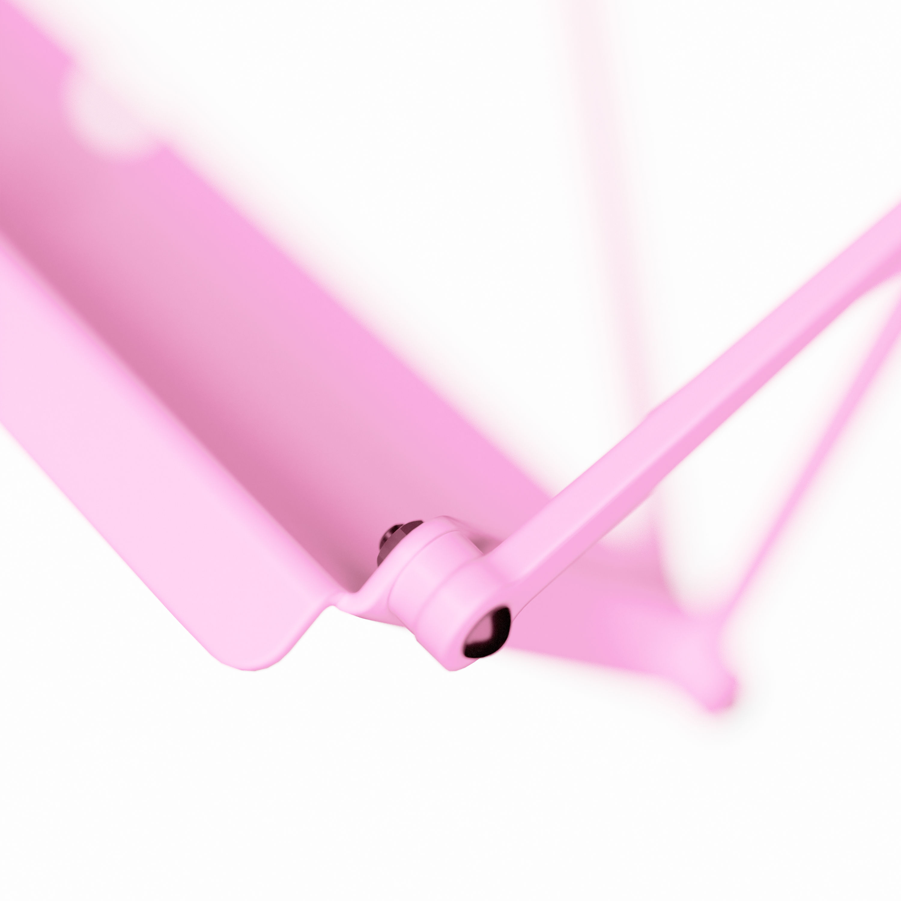 A close-up of a cassette shelf and details, illuminated in pink