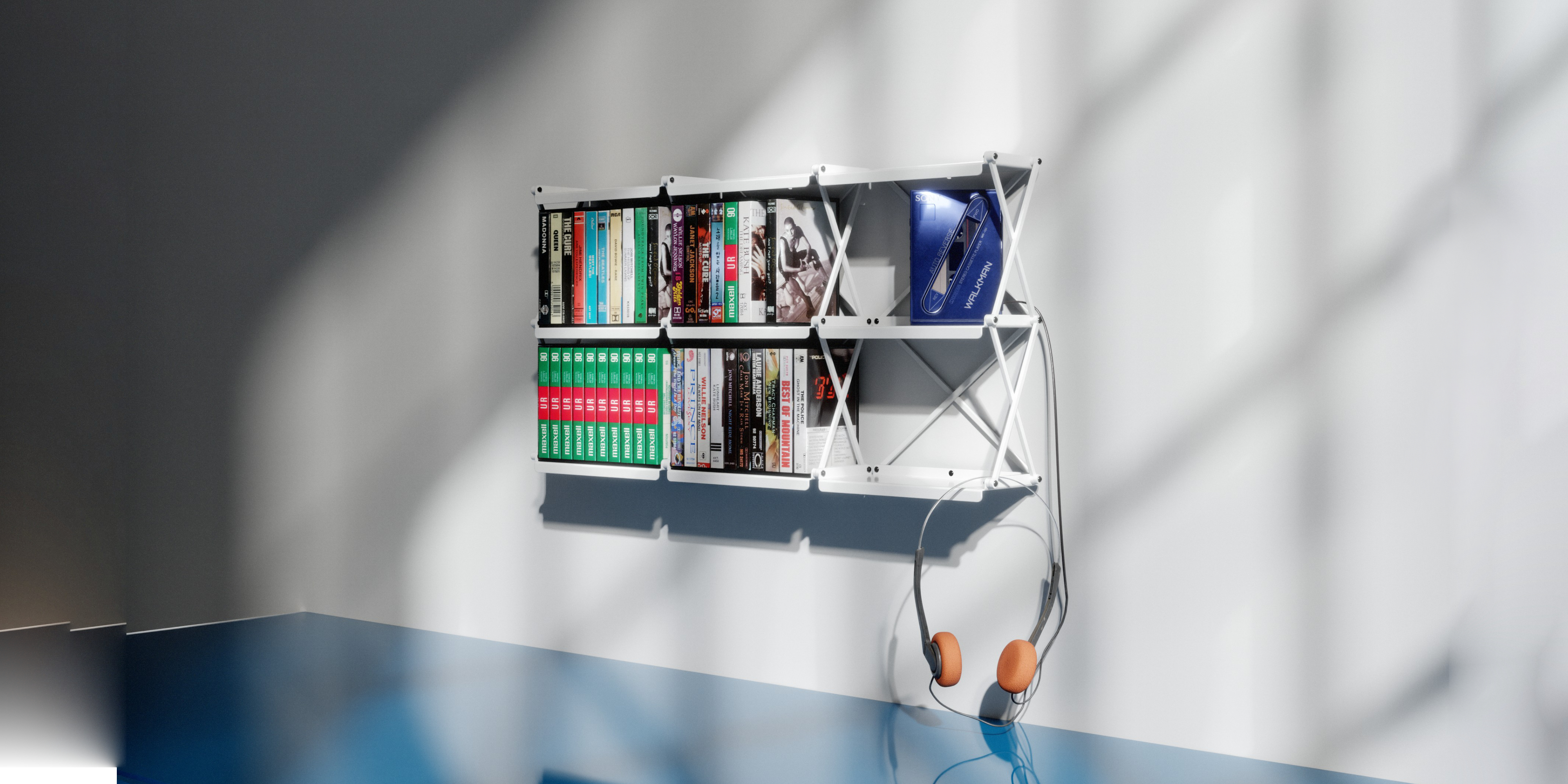 A 2x2 cassetteshelf mounted on a wall and fully loaded with cassette tapes
