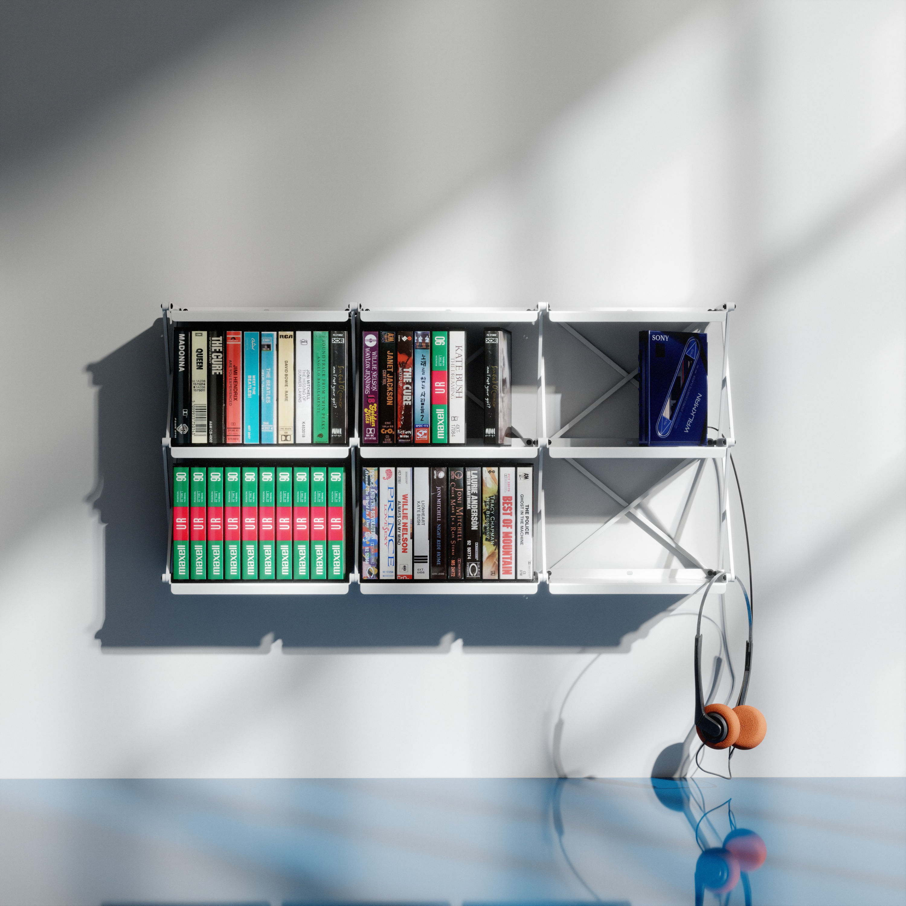 A 2x2 cassetteshelf mounted on a wall and fully loaded with cassette tapes